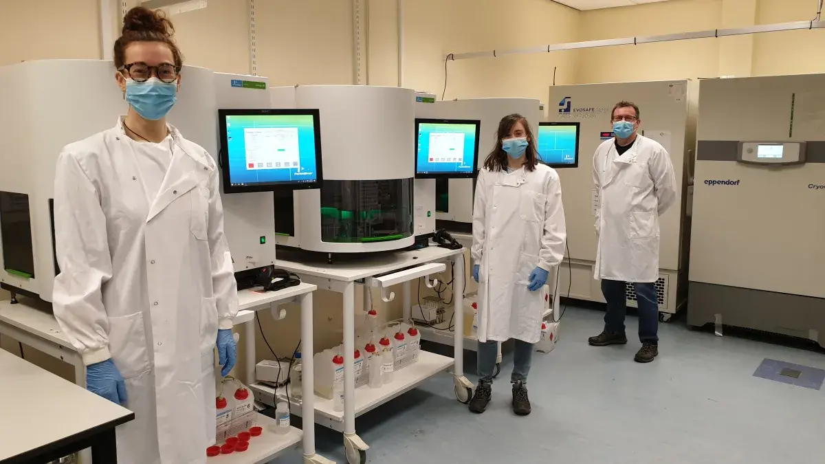 A picture of technicians standing by the Revvity Chemagic systems