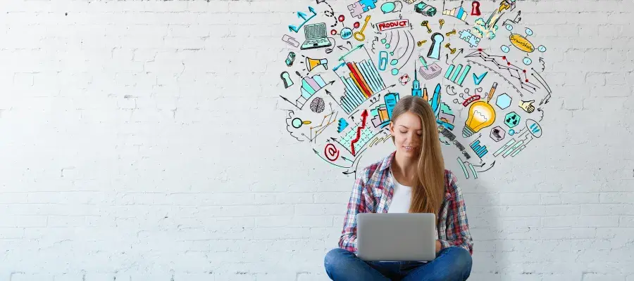 Person sitting in a front of an abstract image on a wall